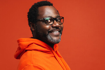 Adult african american man wearing eyeglasses smiling at camera