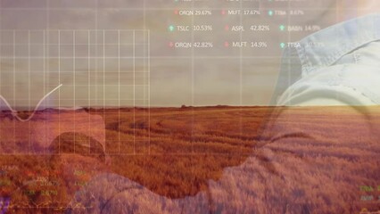 Animation of caucasian man using smartwatch, financial data an agricultural landscape - Powered by Adobe