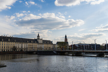 Fototapeta na wymiar Buildings on embankment near river in Wroclaw