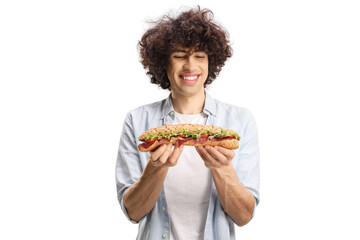 Young man with a curly hair holding a sandwich