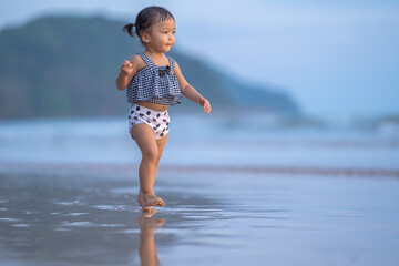 baby girl walking relaxing with happy time in evening time with beautiful sunset light