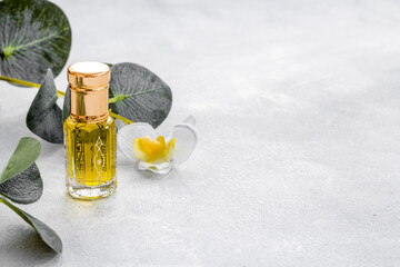 Arabic perfume Oud oil in glass bottle, close up. Aromatic Arabian oil