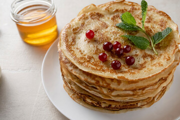 Big pancakes on the table, cooking delicious homemade pancakes