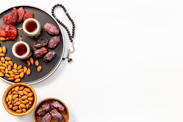 Ramadan Kareem greeting card. Table with dates fruits nuts and islamic rosary