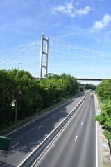 cars and lorry traveling under the Humber Bridge on the A63 Hessle. UK