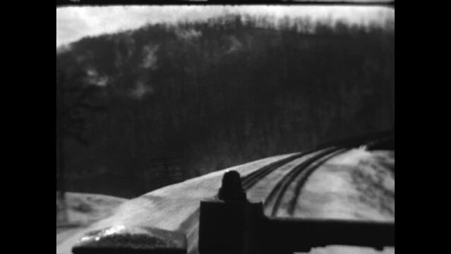 Winter Train Travel 1933 - Views from the caboose as a train travels through a snowy landscape in 1933.