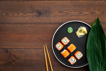 Sushi roll set with salmon and cream cheese on plate. Japanese food