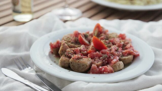 Serving Dakos Appetizer