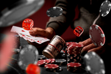 The concept of chips and cards for playing poker on the background of a flying cards.