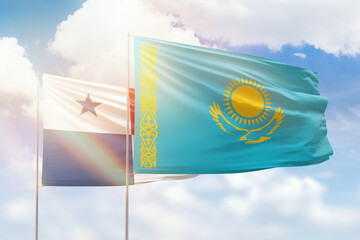 Sunny blue sky and flags of kazakhstan and panama