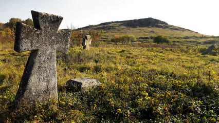 old stone cross on the hill graves old cemetery