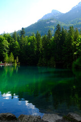 A picture of Blausee Lake with nature view and mountain insight. Famous attraction place in Switzerland.