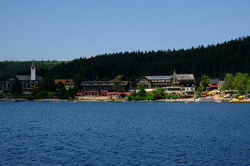 A picture of  Titisee lake wirh famous hotel and other attraction insight. Titisee is one of famous holiday place in Black Forest.