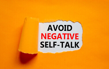 Avoid negative self-talk symbol. Concept words Avoid negative self-talk on a beautiful orange background. Psychological and Avoid negative self-talk concept. Copy space.