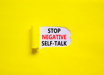 Stop negative self-talk symbol. Concept words Stop negative self-talk on a beautiful yellow background. Psychological and stop negative self-talk concept. Copy space.