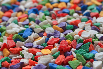 Many colored stone backgrounds are colored stones that are used in rock garden decorations or used to cover the soil surface in pots of cactus because of their beautiful colors.