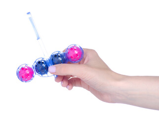 Toilet balls cleaner in hand on white background isolation