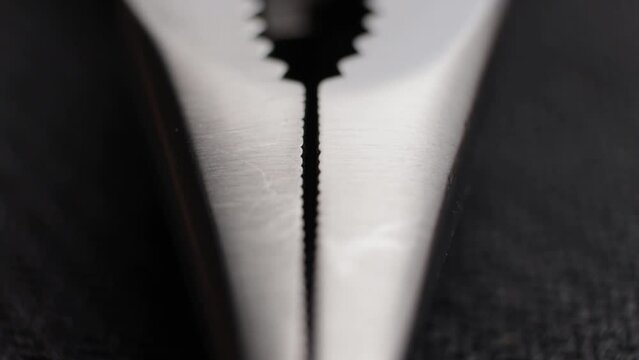 Macro Close up of a multi tool pliers and other pocket tools
