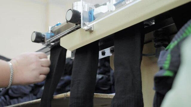 Cotton socks production process in garment factory, automated process, sewing up the sock