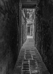 black and white narrow street alley in Venice, Italy 