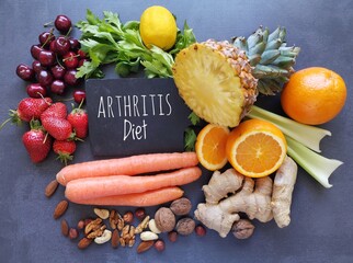 Healthy foods to help arthritis pain. Assortment of fresh fruit and vegetable for arthritis and inflammatory pain. Inflammation fighting foods, concept of rheumatoid arthritis diet. - obrazy, fototapety, plakaty