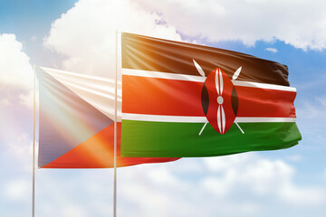 Sunny blue sky and flags of kenya and czechia