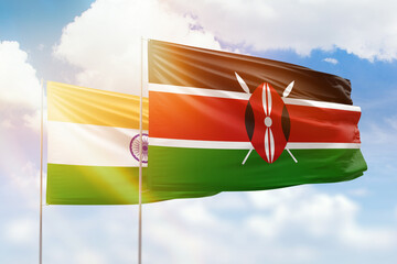 Sunny blue sky and flags of kenya and india