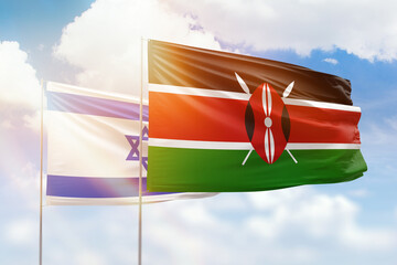 Sunny blue sky and flags of kenya and israel