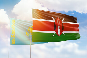 Sunny blue sky and flags of kenya and kazakhstan
