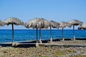 Fototapeta na wymiar wooden sunshades at the beach of havana miramar