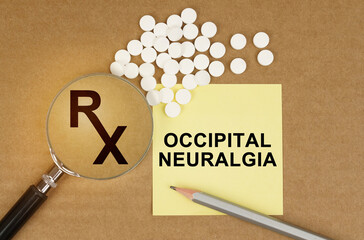 On the table are pills, a magnifying glass, pencils and a sticker with the inscription - Occipital...