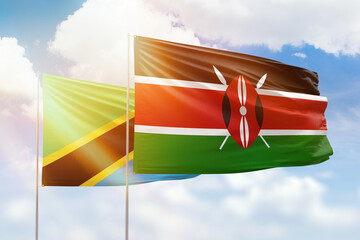 Sunny blue sky and flags of kenya and tanzania