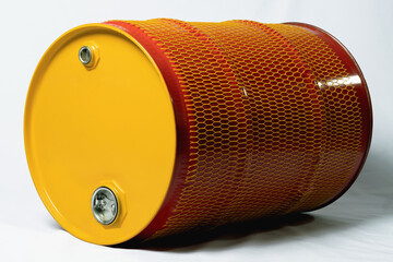 A metal red-yellow barrel lies on a white background...