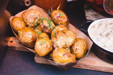 Baked whole potatoes in the skin at street market