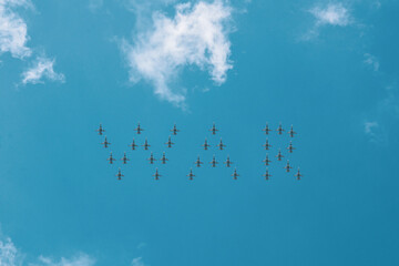 Fighters in the sky. A group of fighters in the sky lined up in the word war
