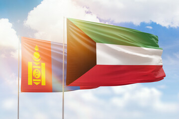 Sunny blue sky and flags of kuwait and mongolia