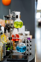Chemical laboratory for the study of pathogenic viruses, glass flasks are fixed on a tripod, a bar...