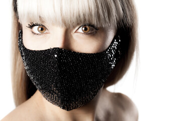 Beautiful brunette girl with blond hair fringe bangs wearing black fashionable protective face...
