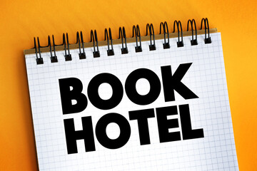 Book Hotel text on notepad, concept background