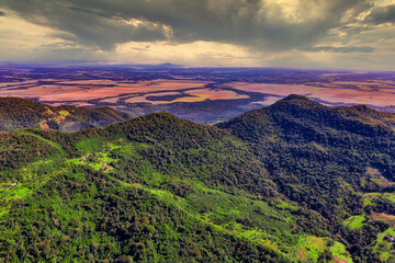Aerial view of the Ybytyruzu Mountains with the flat plain below in Paraguay from a height of 500 meters.