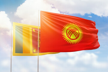 Sunny blue sky and flags of kyrgyzstan and sri lanka