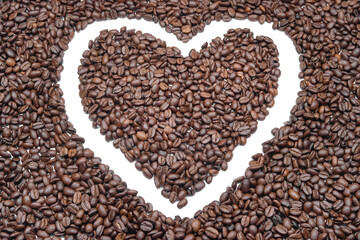 roasted coffee beans forming the shape of a heart, a symbol of love and passion for caffeine and life. (cardiology, health, gastronomy, lifestyle)