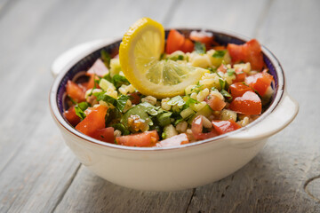 Lebanese tabbouleh salad with bulgur, parsley, tomato and cucmber