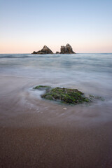 Fototapeta premium Beach and waves at sunset