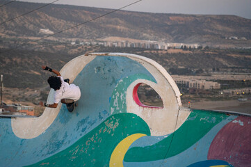 Skateboarder at skatepark in Taghazout, Morocco © Melissa K Sharp
