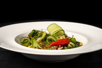 risotto with green salad with cucumber and chili