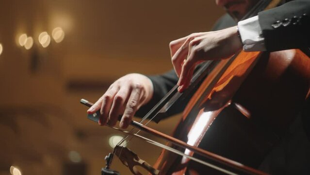 Talented Man Is Playing Cello On Scene Of Old Opera House, Closeup Of Hands Of Cellist