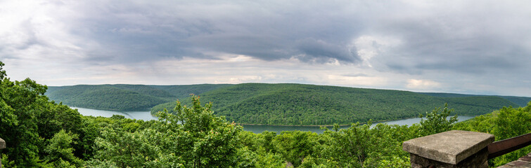 panorama of the lake and mountains taken from a viewing area 
