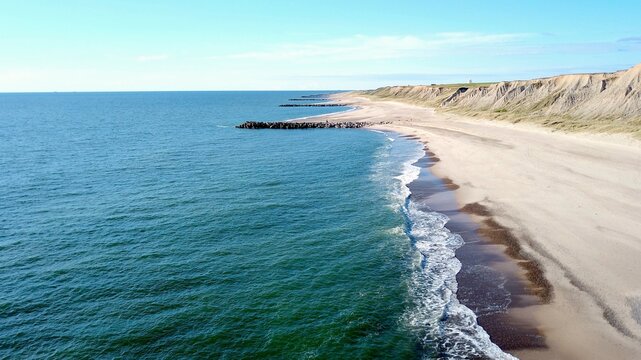 Cliffs and breakwaters on the coast of Bovbjerg Fyr at Ferring near Lemvig, Midtjylland region in western Denmark, high quality aerial view image