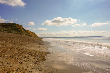 south coast landscape of Britain. view along shore of coastal beach in Hampshire England. rugged cliff coastline